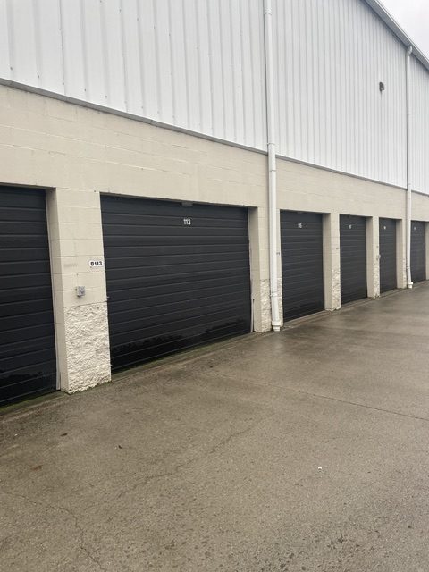 commercial garage doors before by 99 Dollar Painter in Middle Tennessee