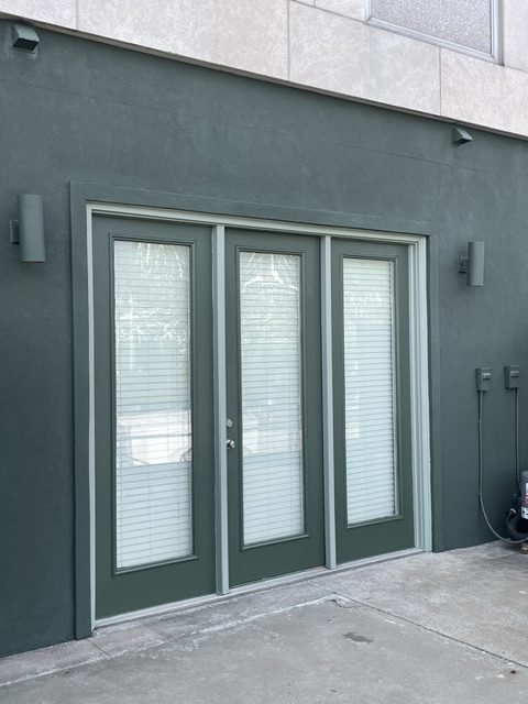 green commercial doors painting by 99 Dollar Painter in Middle Tennessee